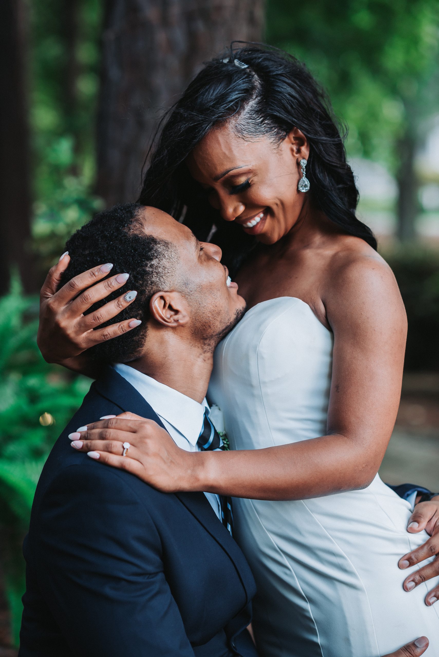 Bride and groom captured taking intimate and romantic photos on their wedding day.