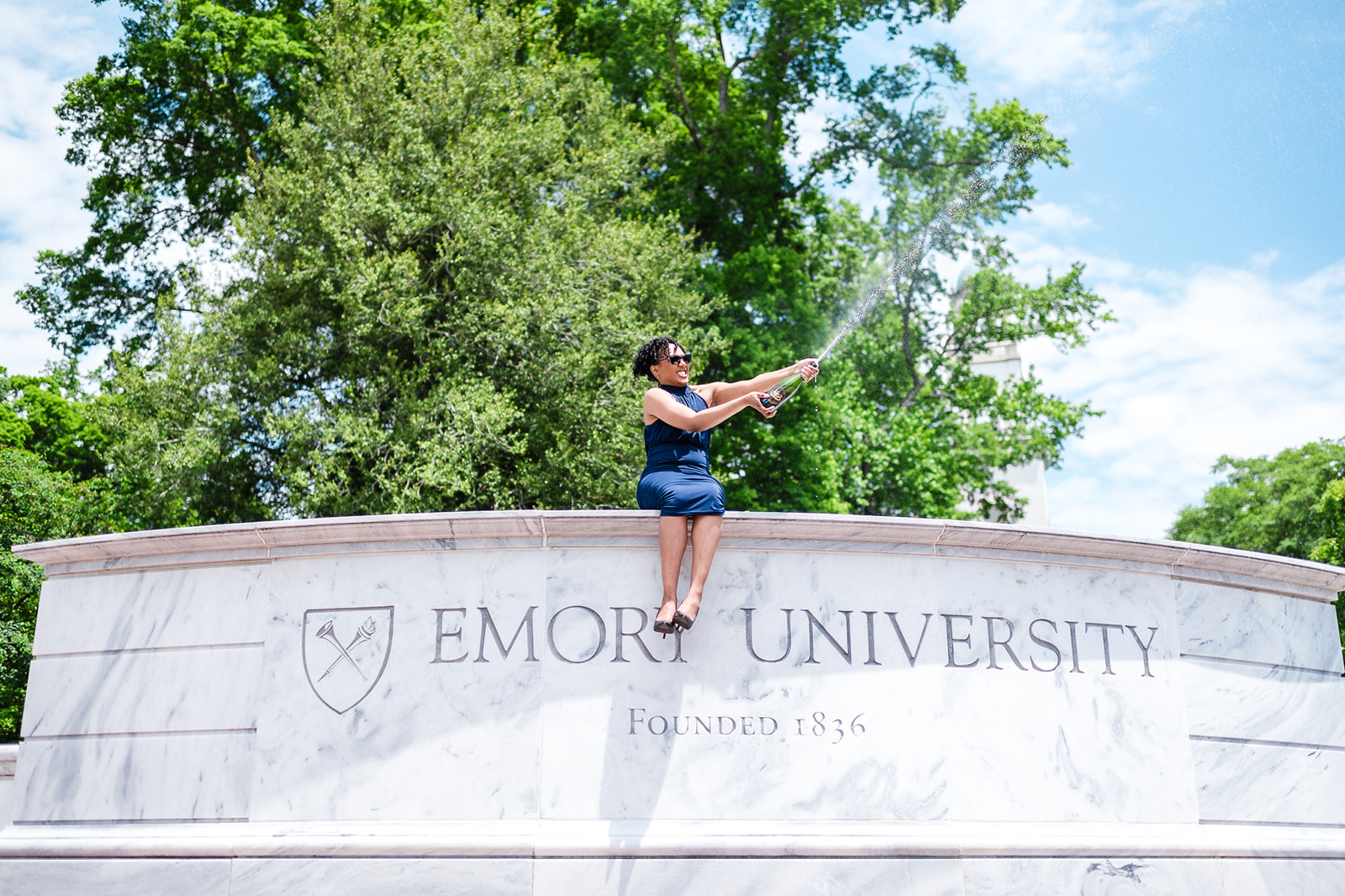 Emory University Graduate getting photos captured for her graduation celebration