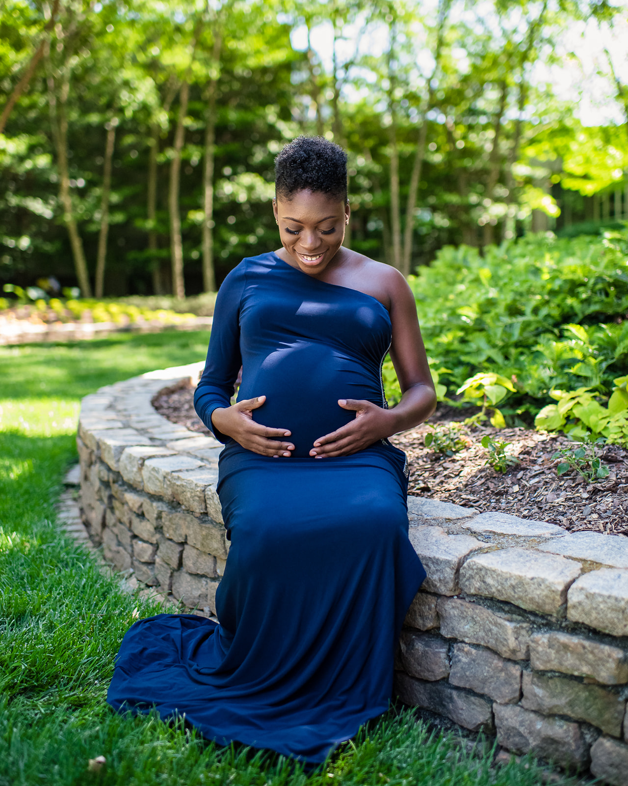 Stunning Portrait Photography Maternity photos of client in her lovely blue dress. Maternity photoshoot was done at the King and Queen Building in Sandy Springs.