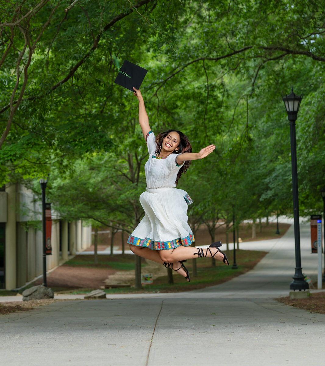 Portrait Photography Graduation Photo taken of client celebrating graduating from Mercy University Atlanta Campus