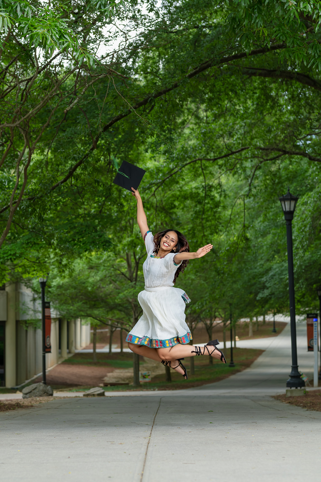 Portrait Photography Graduation Photo taken of client celebrating graduating from Mercy University Atlanta Campus