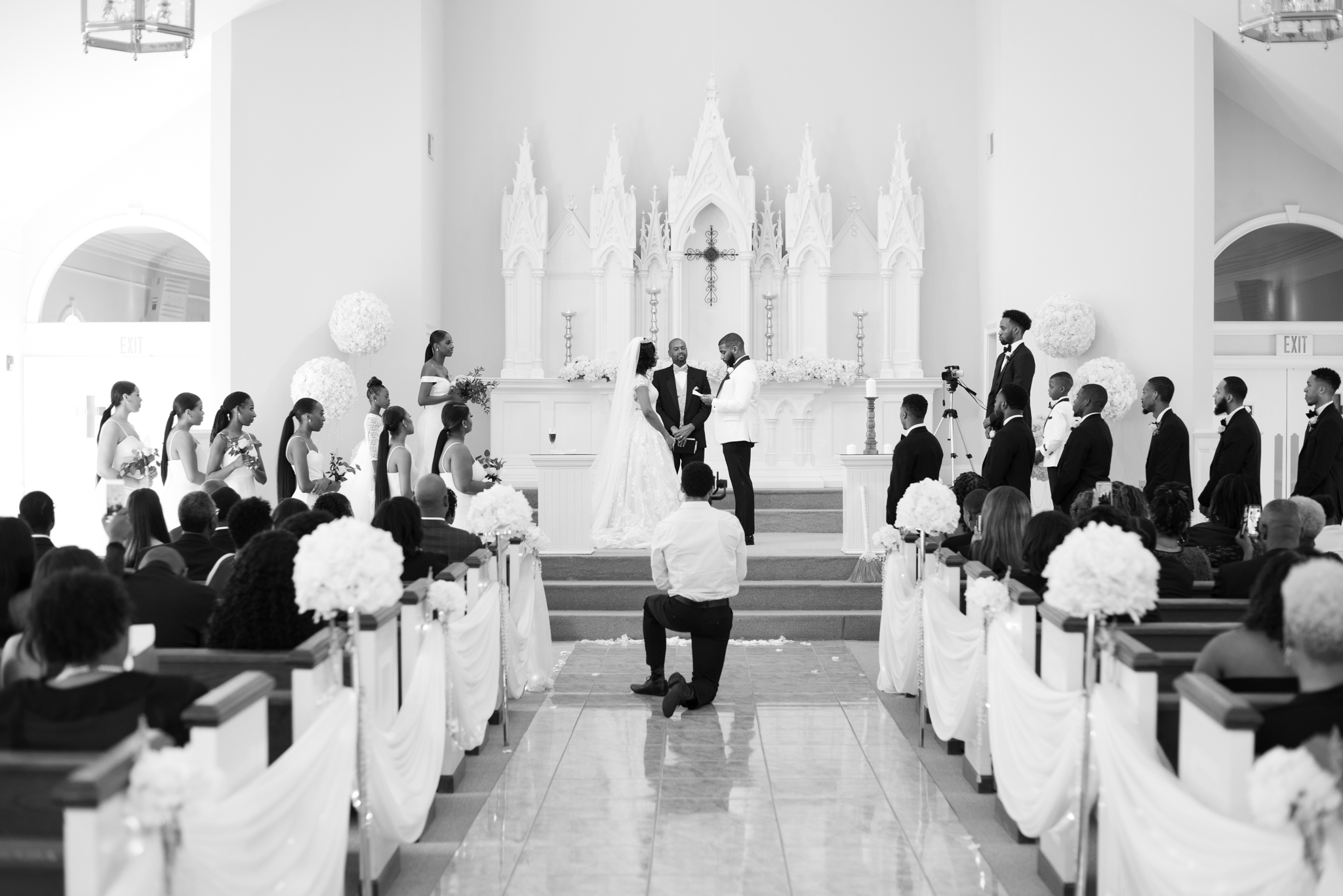 Photo taken of bride and groom exchanging their vows at Pristine Chapel, on their wedding day.