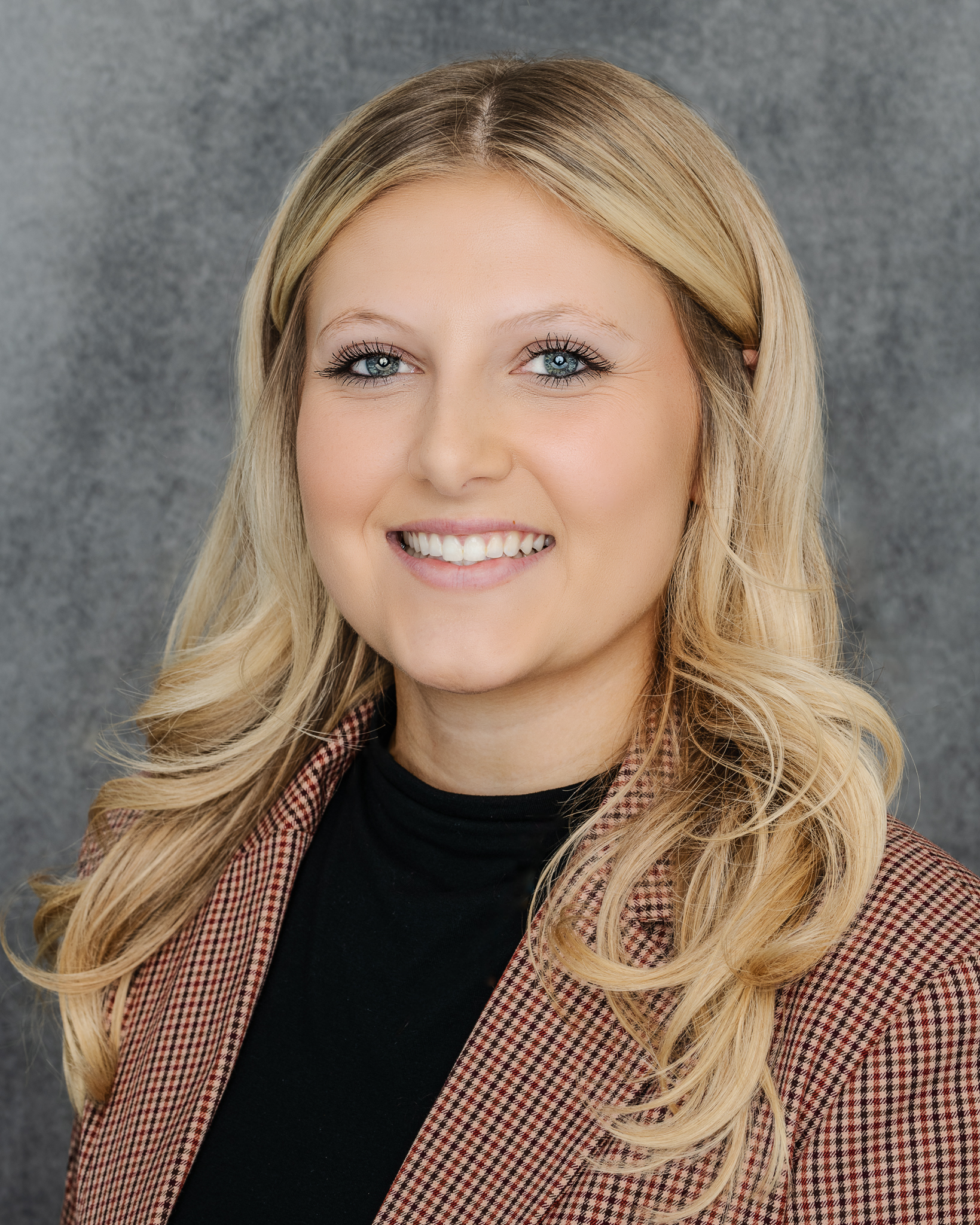 Professional headshot of IBM Watston Associate, against a clean backdrop, exuding confidence and approachability. Crisp attire and a friendly smile convey a polished and competent professional image, perfect for LinkedIn profiles and business websites.